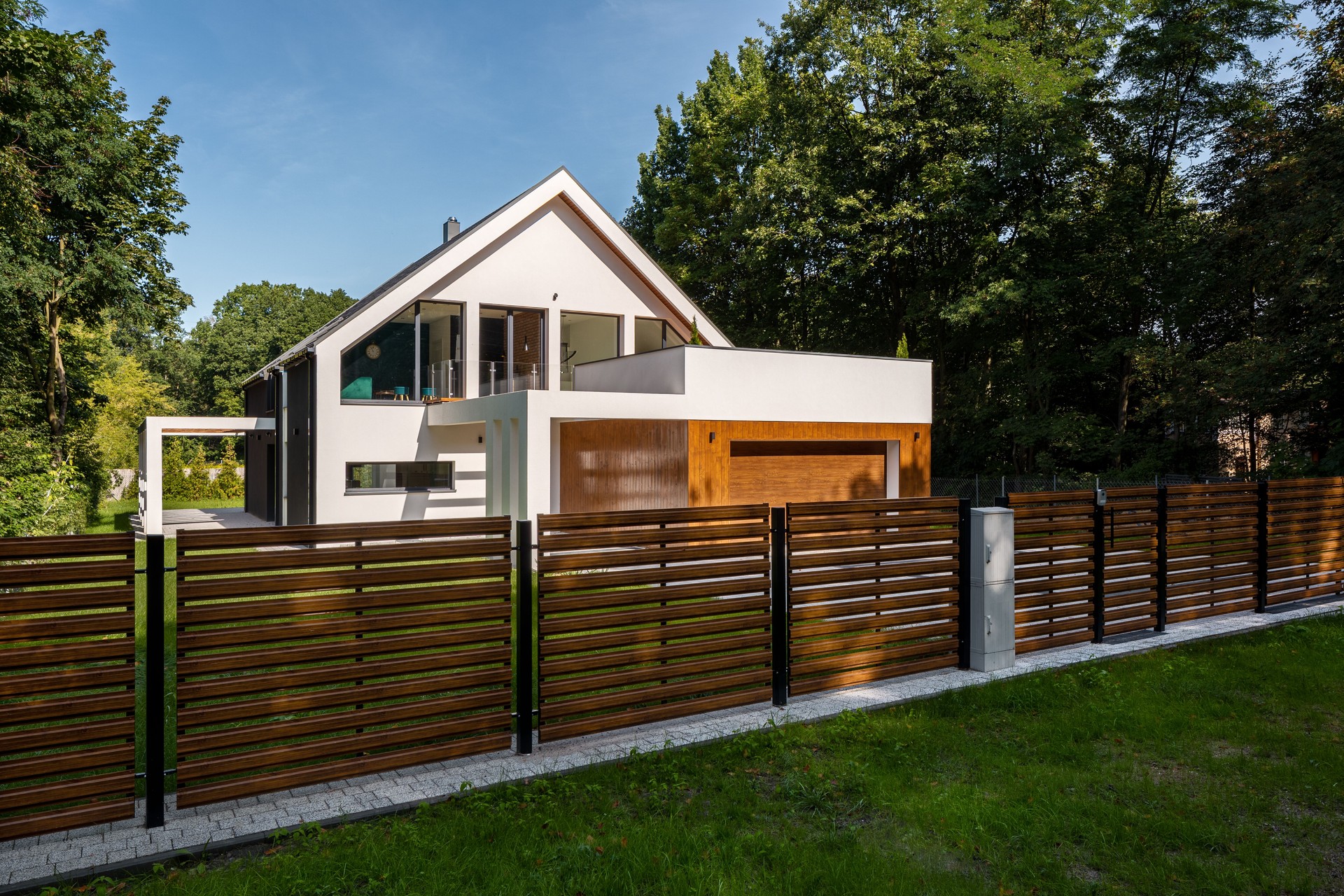 Sturdy wooden fence surrounding a well-maintained property, providing security and aesthetic value in Ocala, FL.